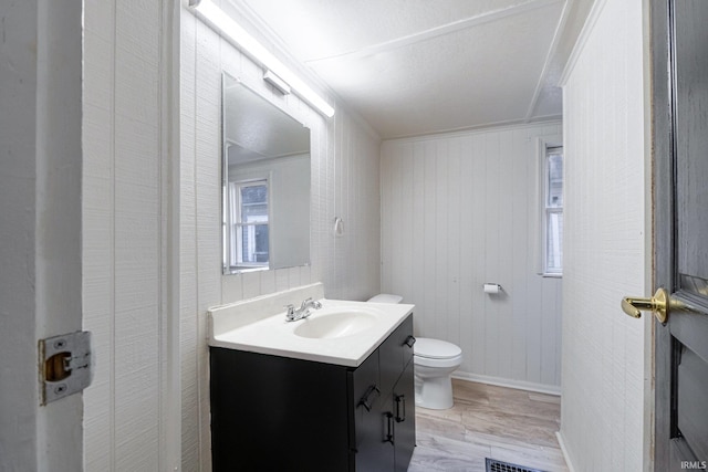 1437 Oakland St, Fort Wayne, IN 46808 - bathroom featuring wood finished floors, toilet, and vanity