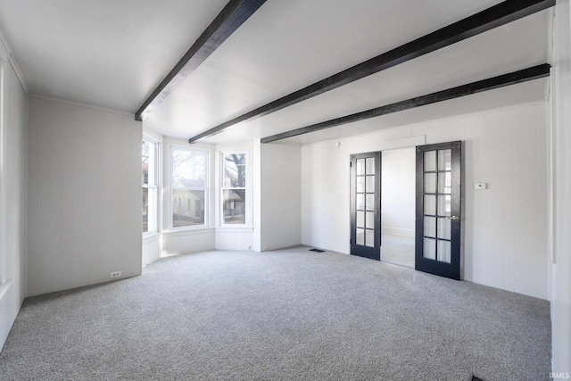1437 Oakland St, Fort Wayne, IN 46808 - carpeted spare room featuring beam ceiling and french doors