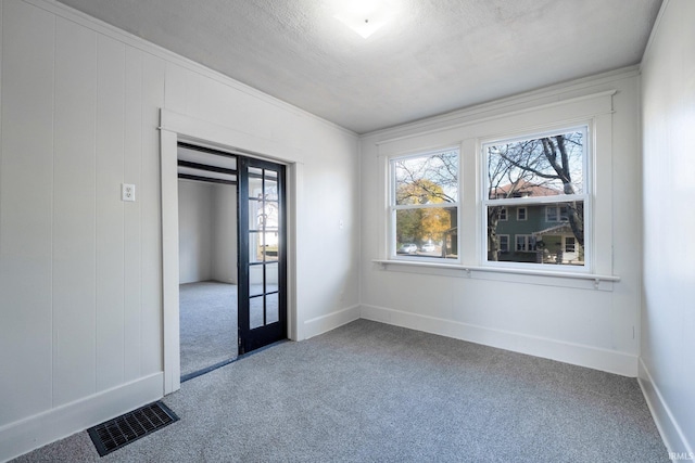 1437 Oakland St, Fort Wayne, IN 46808 - carpeted spare room with plenty of natural light, crown molding, and baseboards