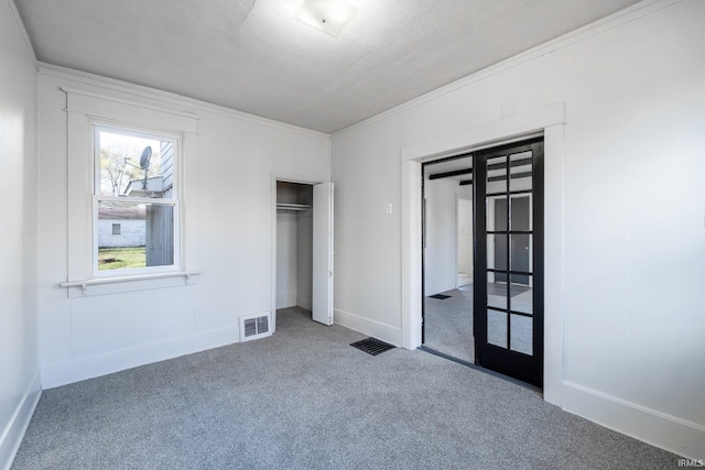 1437 Oakland St, Fort Wayne, IN 46808 - unfurnished bedroom featuring carpet floors, a closet, ornamental molding, and baseboards