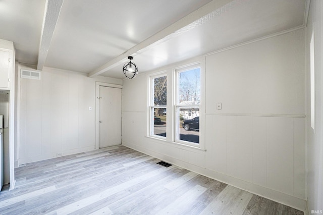 1437 Oakland St, Fort Wayne, IN 46808 - unfurnished dining area with beam ceiling and light wood-style flooring