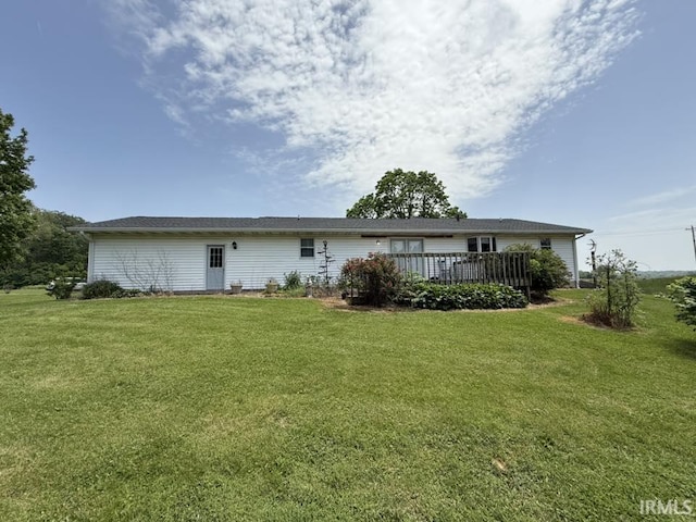 6311 N Camp Arthur Rd, Bruceville, IN 47516 - rear view of house featuring a lawn and a wooden deck