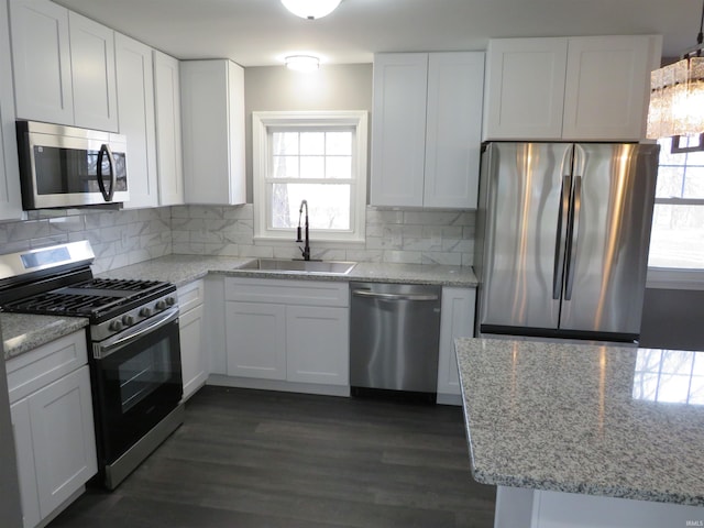 2607 S Airport Rd, Monticello, IN 47960 - kitchen with stainless steel appliances, a sink, plenty of natural light, and white cabinets