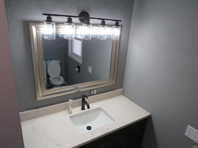 2607 S Airport Rd, Monticello, IN 47960 - bathroom featuring vanity and a textured wall
