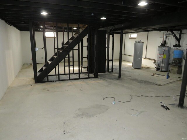 2607 S Airport Rd, Monticello, IN 47960 - below grade area featuring gas water heater, water heater, and stairs
