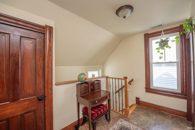 1422 Virginia St, Lafayette, IN 47905 - bonus room with baseboards, vaulted ceiling, and dark stone finish floors