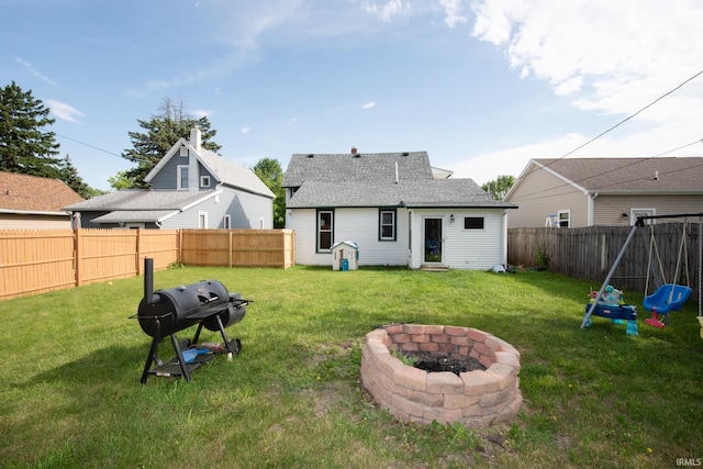 1422 Virginia St, Lafayette, IN 47905 - back of property with a fire pit, entry steps, and a shingled roof