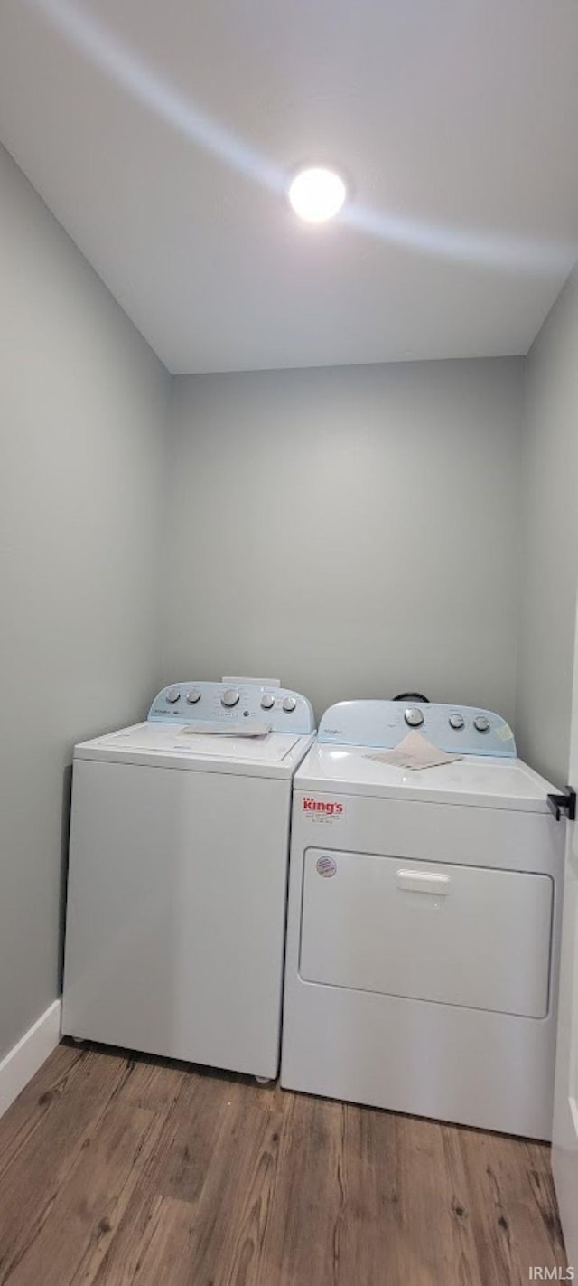 377 N 3rd St, Montgomery, IN 47558 - laundry room featuring washer and dryer, light wood-style flooring, and baseboards