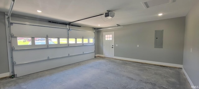 377 N 3rd St, Montgomery, IN 47558 - garage with electric panel, a garage door opener, recessed lighting, and baseboards
