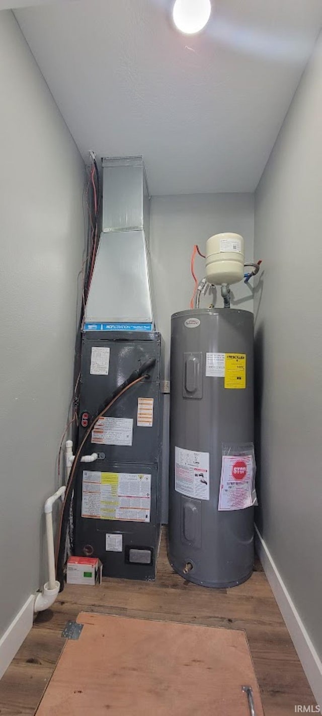 377 N 3rd St, Montgomery, IN 47558 - utility room with water heater and heating unit