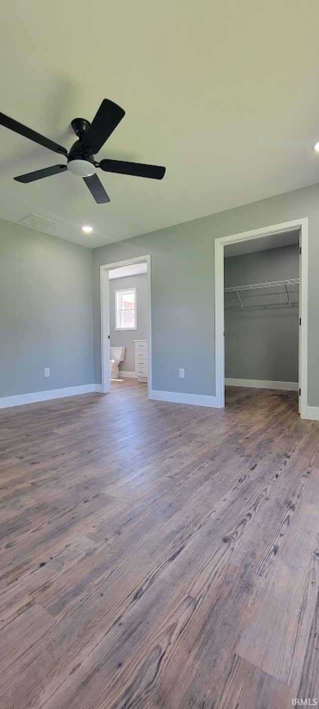 377 N 3rd St, Montgomery, IN 47558 - unfurnished bedroom with wood finished floors, baseboards, a closet, and ceiling fan