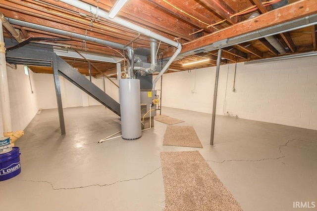 904 Hall Ave, Oolitic, IN 47446 - unfinished below grade area with gas water heater and stairway