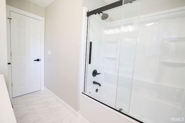904 Hall Ave, Oolitic, IN 47446 - full bath with marble look tile flooring, combined bath / shower with glass door, and baseboards