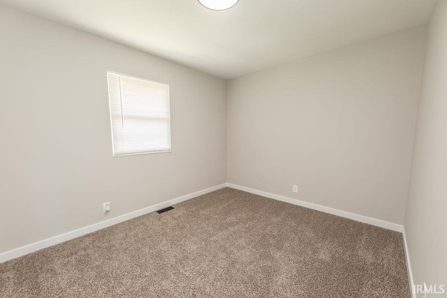 904 Hall Ave, Oolitic, IN 47446 - carpeted empty room featuring baseboards