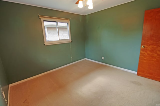 2301 E Delaware St, Evansville, IN 47711 - carpeted spare room featuring a ceiling fan and baseboards