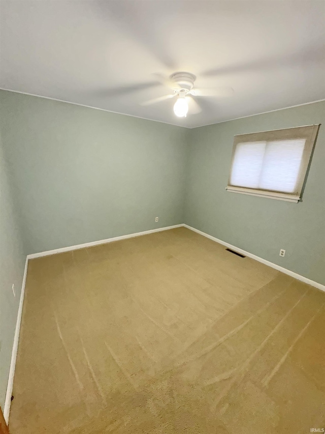 2301 E Delaware St, Evansville, IN 47711 - unfurnished room with a ceiling fan, carpet floors, and baseboards