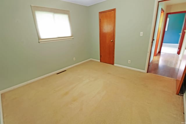 2301 E Delaware St, Evansville, IN 47711 - unfurnished bedroom with baseboards and carpet