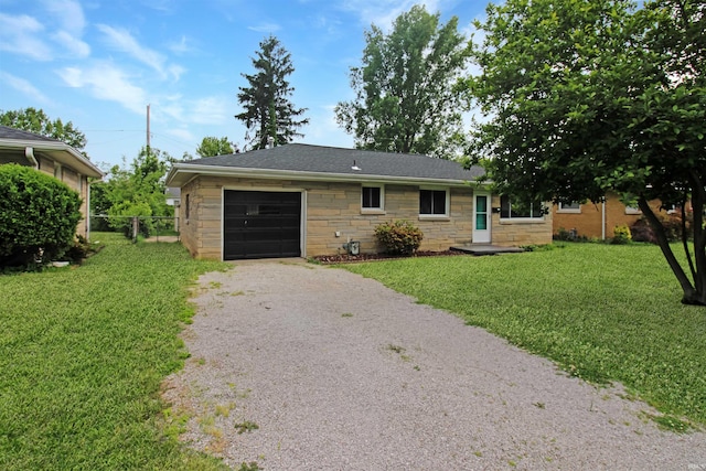 2301 E Delaware St, Evansville, IN 47711 - ranch-style home with stone siding, a garage, and gravel driveway