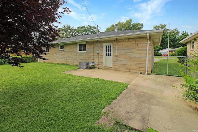 2301 E Delaware St, Evansville, IN 47711 - rear view of property featuring stone siding, a patio area, and central AC unit