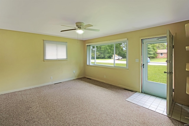 2301 E Delaware St, Evansville, IN 47711 - spare room with carpet flooring, a ceiling fan, and baseboards