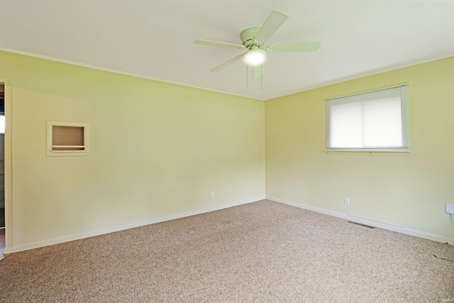2301 E Delaware St, Evansville, IN 47711 - carpeted spare room featuring ceiling fan and baseboards