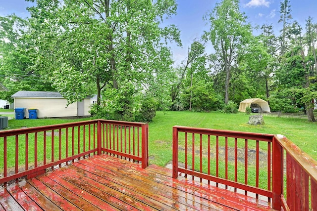 303 Fieldcrest Dr, Angola, IN 46703 - wooden deck featuring a lawn, central air condition unit, and view of scattered trees