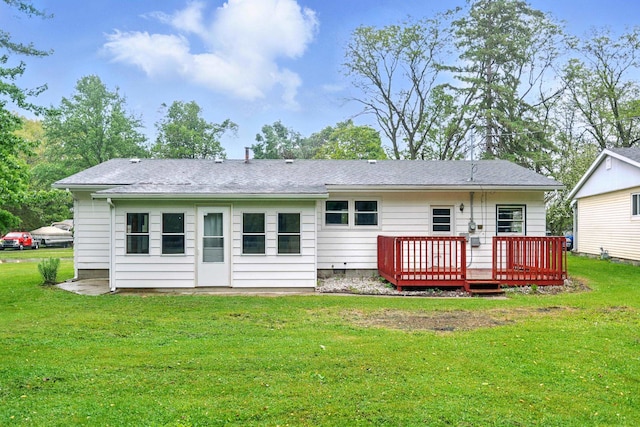 303 Fieldcrest Dr, Angola, IN 46703 - rear view of house featuring a wooden deck, a yard, and roof with shingles