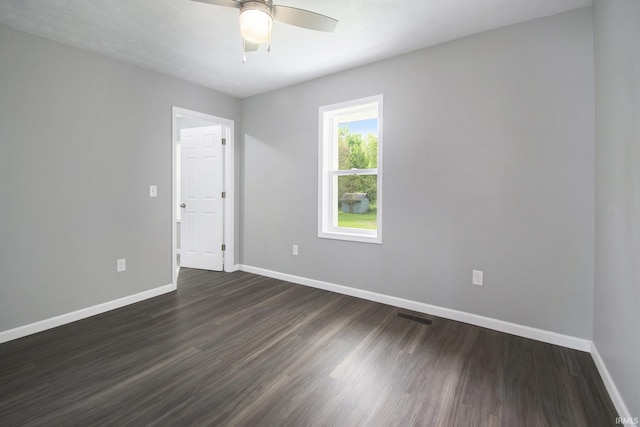 10974 County Road 10, Middlebury, IN 46540 - unfurnished room featuring baseboards, dark wood finished floors, and ceiling fan