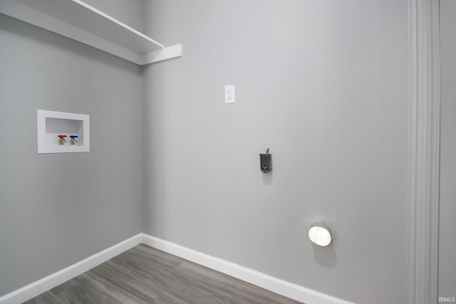 10974 County Road 10, Middlebury, IN 46540 - laundry area featuring washer hookup, wood finished floors, and baseboards