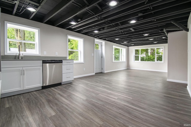 10974 County Road 10, Middlebury, IN 46540 - kitchen featuring stainless steel dishwasher, open floor plan, a sink, baseboards, and dark wood-style floors