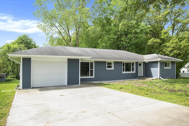 10974 County Road 10, Middlebury, IN 46540 - ranch-style house with driveway, a front yard, a garage, and roof with shingles