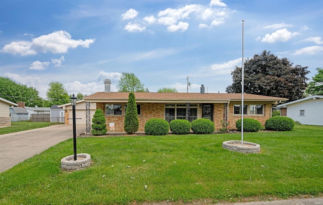 1300 Belvedere Dr, Kokomo, IN 46902 - ranch-style house with brick siding, a front yard, and a chimney