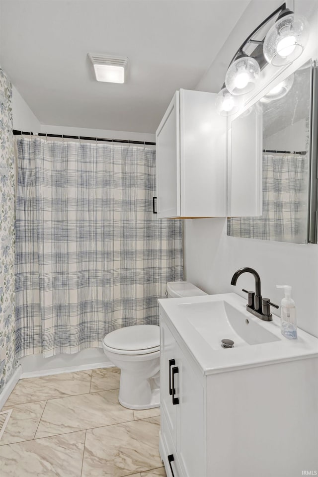 1300 Belvedere Dr, Kokomo, IN 46902 - bathroom with vanity, toilet, and marble look tiles