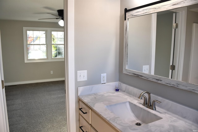 7019 Bull Rapids Rd, Woodburn, IN 46797 - bathroom with a ceiling fan, vanity, and baseboards