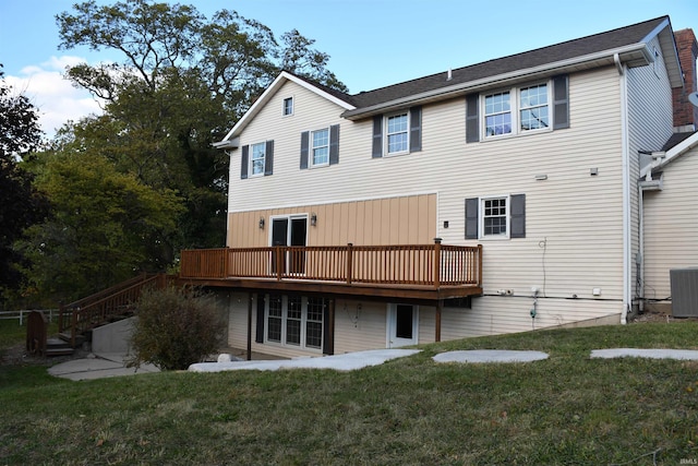 7019 Bull Rapids Rd, Woodburn, IN 46797 - rear view of property featuring a wooden deck, a yard, central AC, and stairs