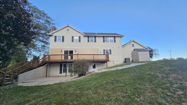7019 Bull Rapids Rd, Woodburn, IN 46797 - rear view of house featuring a patio area, a chimney, stairway, a deck, and a yard