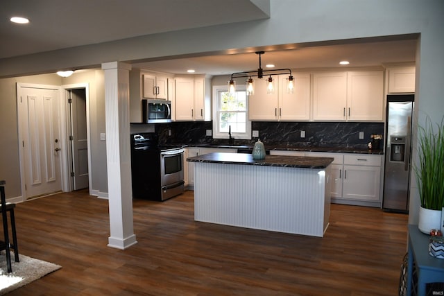 7019 Bull Rapids Rd, Woodburn, IN 46797 - kitchen featuring stainless steel appliances, dark countertops, white cabinetry, backsplash, and recessed lighting