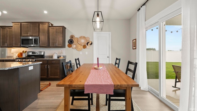 5263 Gadwall Pass, Fort Wayne, IN 46818 - dining space with healthy amount of natural light, light wood finished floors, and recessed lighting