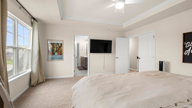 5263 Gadwall Pass, Fort Wayne, IN 46818 - bedroom featuring light carpet, ornamental molding, baseboards, a tray ceiling, and connected bathroom
