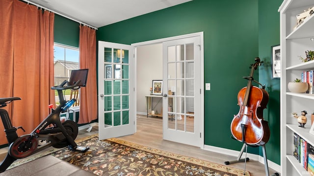 5263 Gadwall Pass, Fort Wayne, IN 46818 - exercise area with french doors, wood finished floors, and baseboards