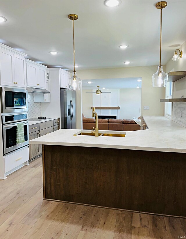 1412 E National Hwy, Washington, IN 47501 - kitchen with stainless steel appliances, a sink, open shelves, decorative light fixtures, and recessed lighting