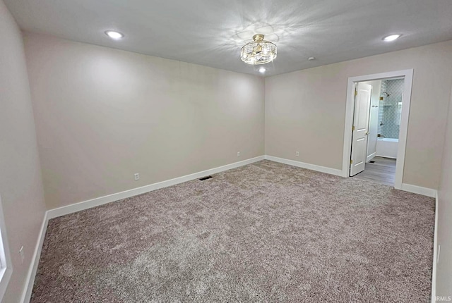 1412 E National Hwy, Washington, IN 47501 - unfurnished room with carpet flooring, baseboards, recessed lighting, and a chandelier