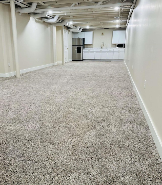 1412 E National Hwy, Washington, IN 47501 - below grade area with stainless steel fridge with ice dispenser, light carpet, and a sink