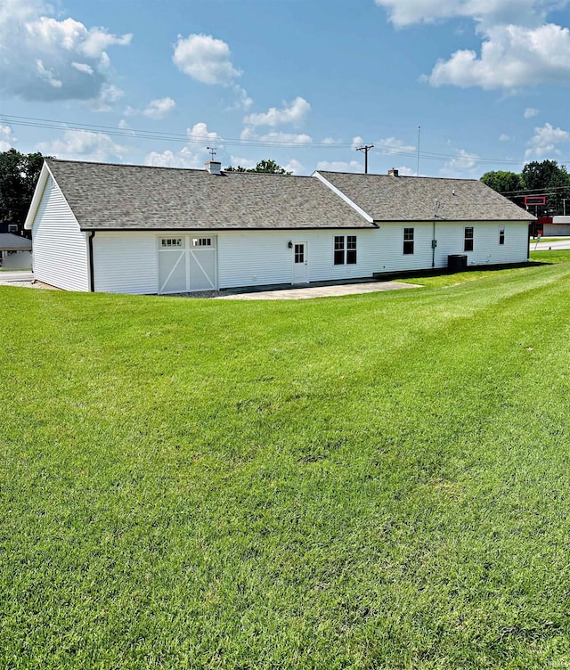 1412 E National Hwy, Washington, IN 47501 - back of house with a lawn and cooling unit