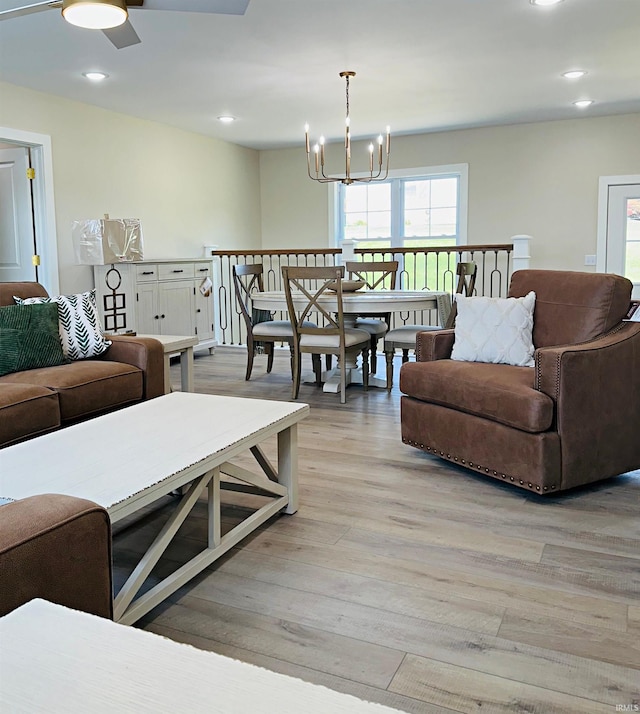 1412 E National Hwy, Washington, IN 47501 - living room featuring light wood-style floors, recessed lighting, a ceiling fan, and a chandelier