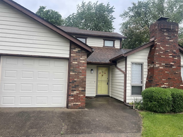 526 Wellington Ct, Lafayette, IN 47904 - view of front facade with concrete driveway, roof with shingles, a garage, and brick siding
