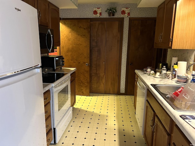526 Wellington Ct, Lafayette, IN 47904 - kitchen featuring white appliances, light countertops, light floors, and a sink