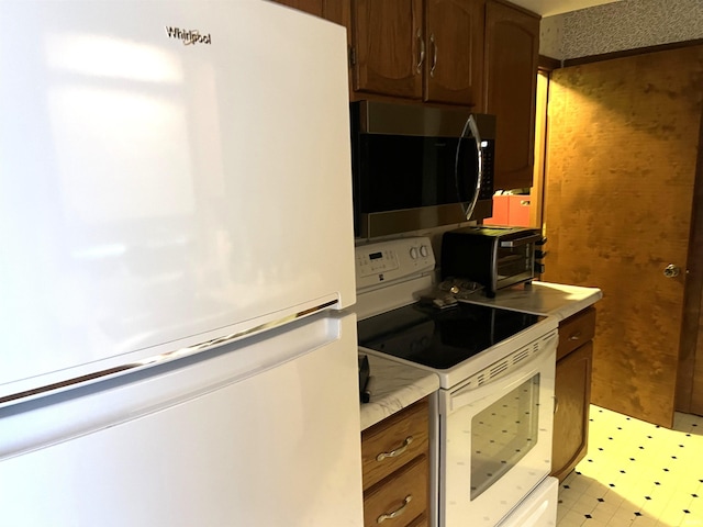 526 Wellington Ct, Lafayette, IN 47904 - kitchen with white appliances, light countertops, and light floors