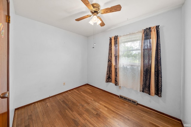 1212 Michigan Ave, Mishawaka, IN 46544 - spare room with hardwood / wood-style floors, baseboards, and ceiling fan