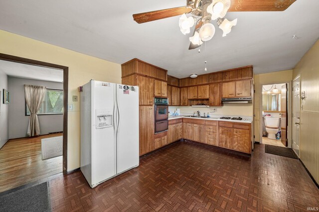 1212 Michigan Ave, Mishawaka, IN 46544 - kitchen with white appliances, a sink, a warming drawer, light countertops, and a ceiling fan